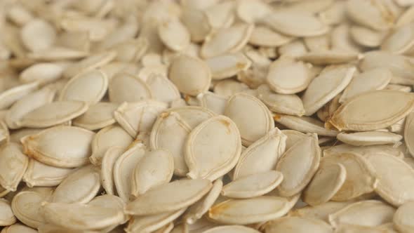 Slow pan over pumpkin seed on pile   4K 2160p 30fps UltraHD footage - Edible pepita close-up 3840X21 alt