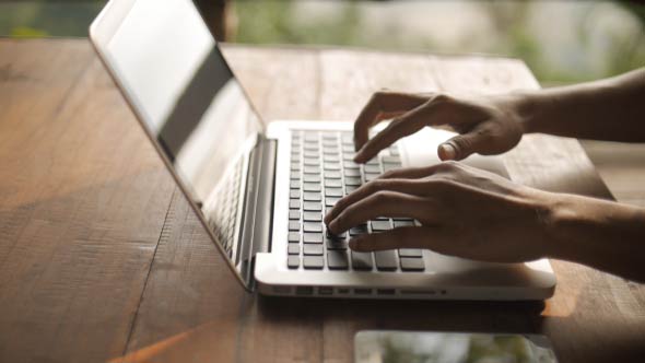 Freelancer Using Laptop alt