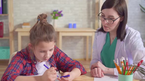 Child Is Autistic and the Doctor in a Medical Office alt