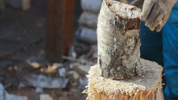 Cutting Wood For Fireplace alt