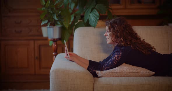 Woman Doing Online Shopping on Digital Tablet Browsing Social Media alt