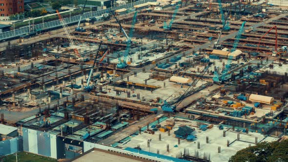 Time lapse of construction site with heavy construction machinery in metropolis alt