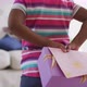 African american daughter giving mother gift on mother's day