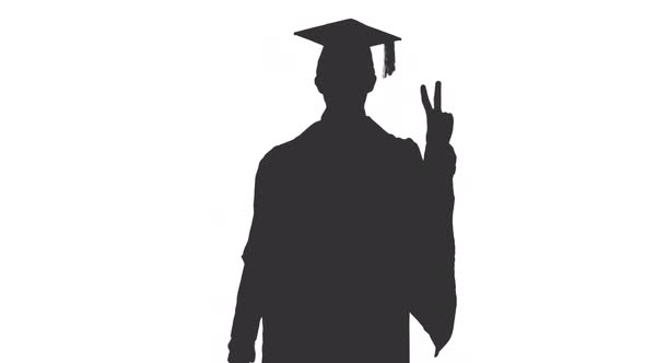 Black And White Silhouette Of Graduate Walking Snd Dhowing V Sign