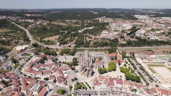 Batalha Monastery and surrounding town, Leiria, Portugal.  Panoramic aerial forward view alt