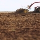 Agricultural Tractor Sowing And Cultivating Field