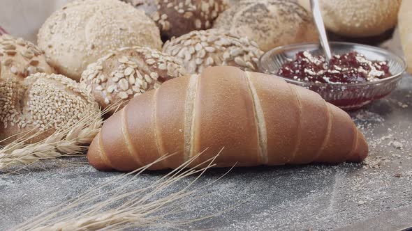 Closeup of Different Types of Fresh Baked Dutch Bread is on the Wooden Table alt