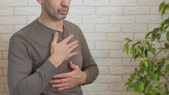 Man Reducing Stress with Breathing alt
