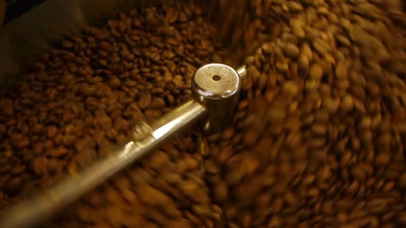 Freshly Roasted Coffee Beans Mixing In A Coffee Roaster