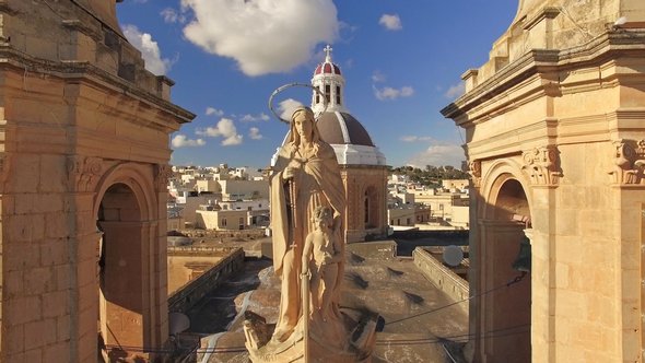 Malta Marsaxlokk Parish Church Front - City Reveal in Background