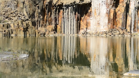 Shore With Basalt Cliffs Near Water