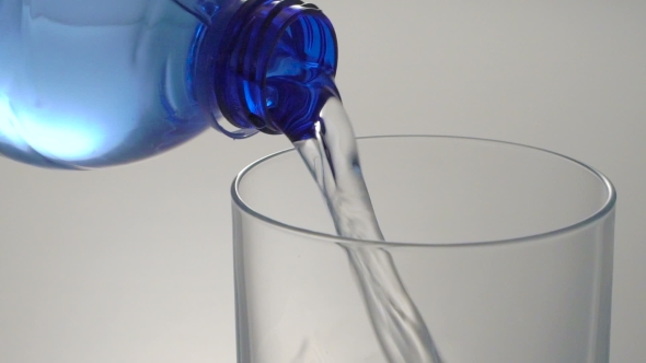 Fresh Cool Water Pouring From a Blue Plastic Water Bottle
