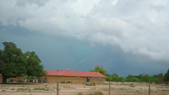View of dangerous rain storm from vehicle driving down highway in Texas alt