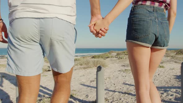 Young couple by the sea alt