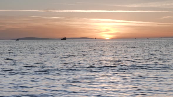 Trawler and Boats Fishing at Sunset