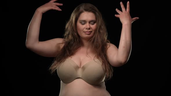 Sensual Plus Size Woman in Lingerie Dancing Touching Body Smiling Looking at Camera alt