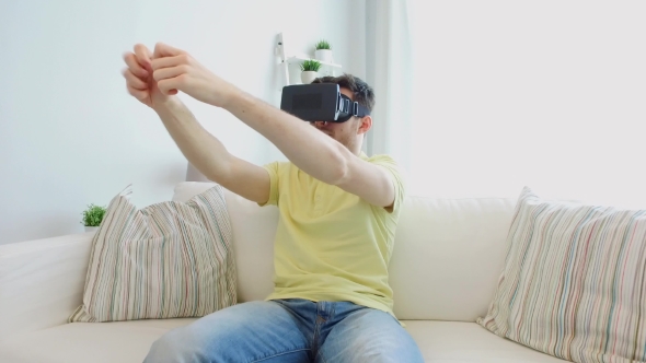 Man In Virtual Reality Headset Playing Game alt