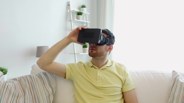 Man In Virtual Reality Headset Playing Game