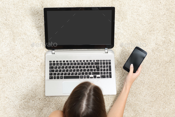Top view of a girl working with tablet and phone