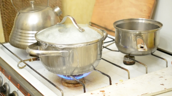 Food Boiling Over In Saucepan