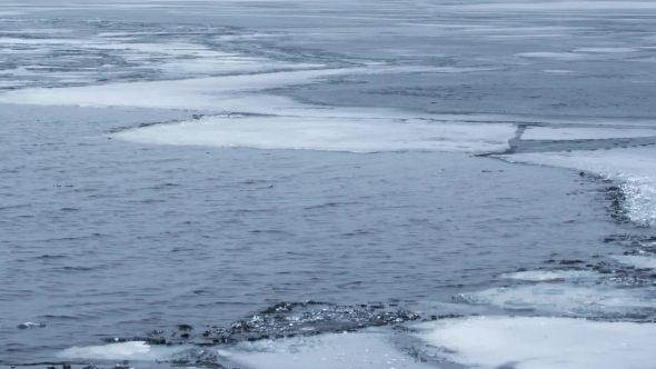 Water Waves On Partly Frozen Lake With Blocks Of Ice