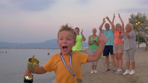 Happy Little Winner Running With Trophy alt