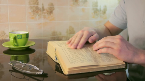 Man Leafing Through Pages
