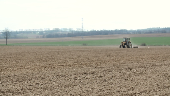 Agricultural Tractor Sowing And Cultivating Field alt