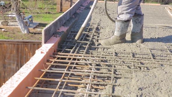 Worker Treated Liquid Concrete Vibrator In a Formwork With Fittings