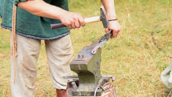 Smith Making a Knife