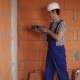 The Electrician Performs Electrical Installation Using a Drill - VideoHive Item for Sale