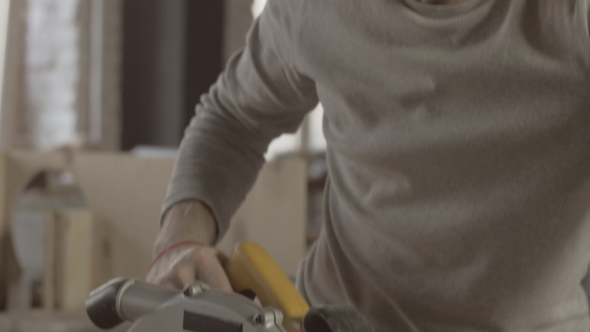 Woodworker Prepare Cut Wooden Board On Straight Line Of Balk. Circular Saw alt