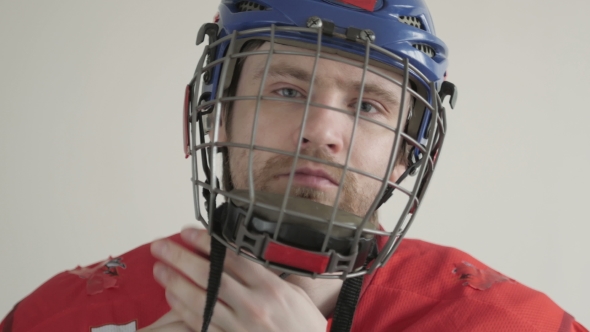 Young Ice Hockey Player Portrait Wearing Helmet On White Backgroud alt