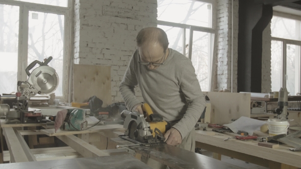 Process Of Cutting Wooden Board By Professional Carpenter. Woodworker. Furniture alt