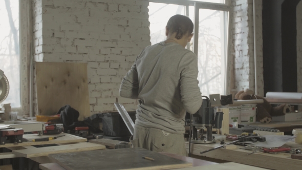 Professional Carpenter Take Drill, Process Of Making Wooden Furniture On Table.  alt