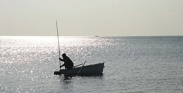 Fisherman on a Little Wood Boat 