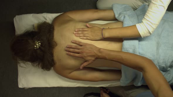 Four-Hand Massage. Flat Lay.