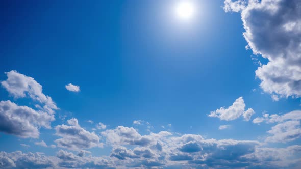 Time Lapse Layered Clouds Move in Blue Sky Under Bright Sun Cloudscape alt
