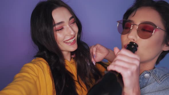 Two Happy Cool Gen z Girls Lesbian Couple Dancing Kissing at Party alt