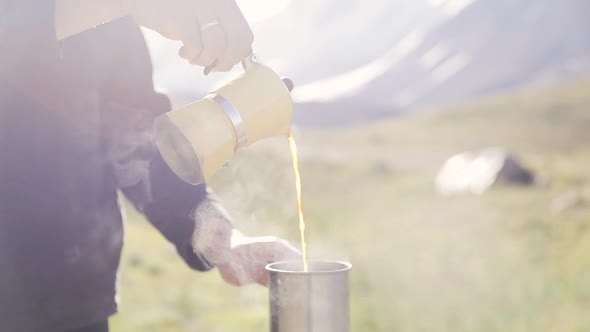 Pouring Coffee From Moka Pot at Nature Outdoor alt