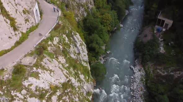 Aerial view from a drone on a road in the mountains. alt