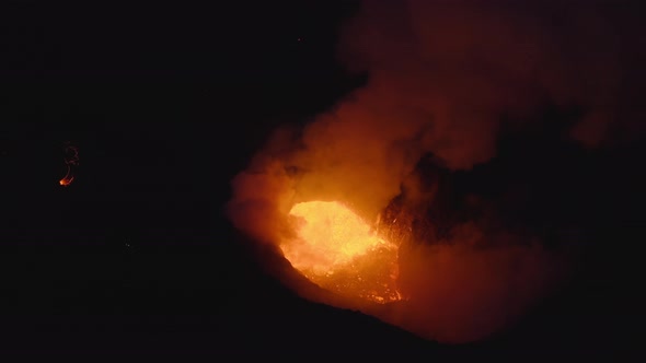 Drone Of Volcano Erupting With Smoke And Molten Lava alt