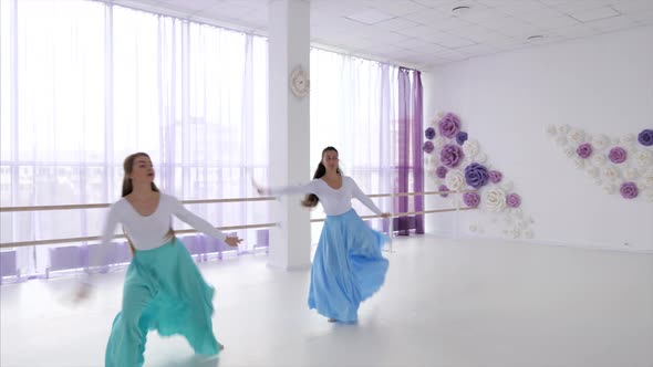Two Ballerinas Is Rehearsing a Dancing Elements Together