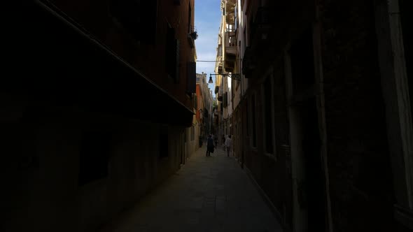 Walking on a narrow street 