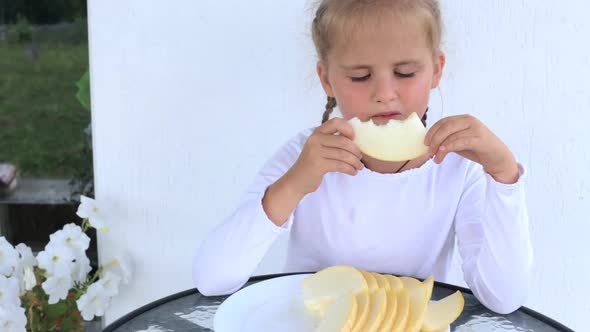 Child Girl Eats Sweet Melon