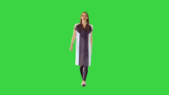 Cyber Girl in Leather Black and White Jacket Walks on a Green Screen Chroma Key