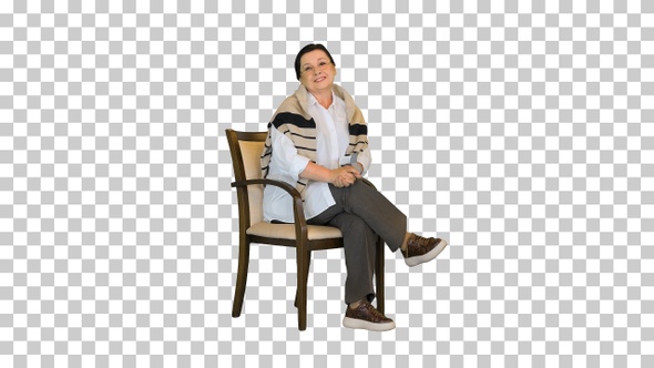 Mature woman using blood pressure measurement, Alpha Channel alt