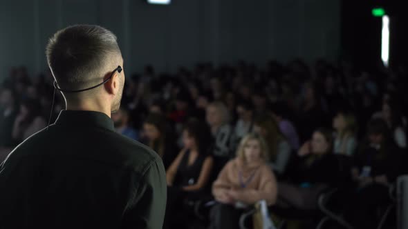 Man Public Speaker Talking at Education Forum alt