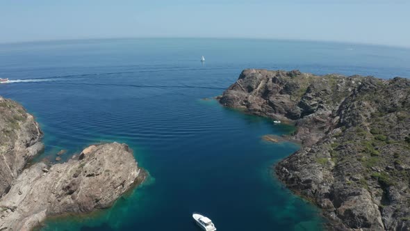 Aerial Shot of Sailboat in Blue Mediterranean Sea alt