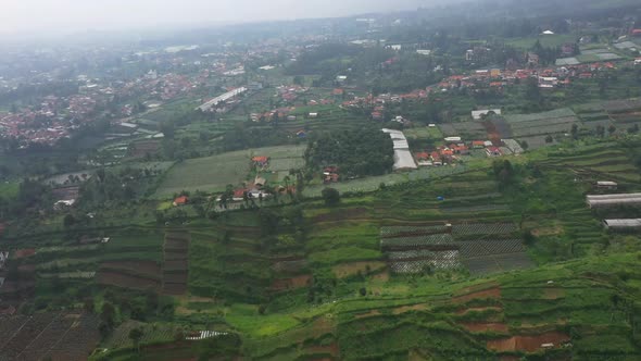 Aerial view of a foggy farm field in suburban area in Asia country